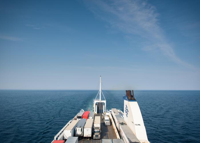 View of the ocean behind a commercial ship.