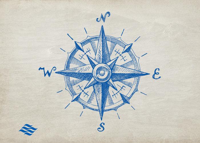 blue compass on parchment paper textured background