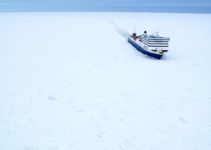 vessel travelling through snow covered ocean