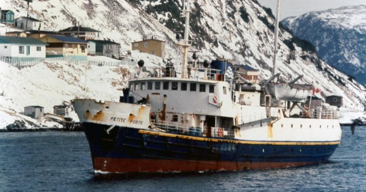 MV Petite Forte sailing away from snowy town