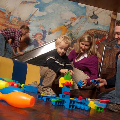 Toddler playing with parents