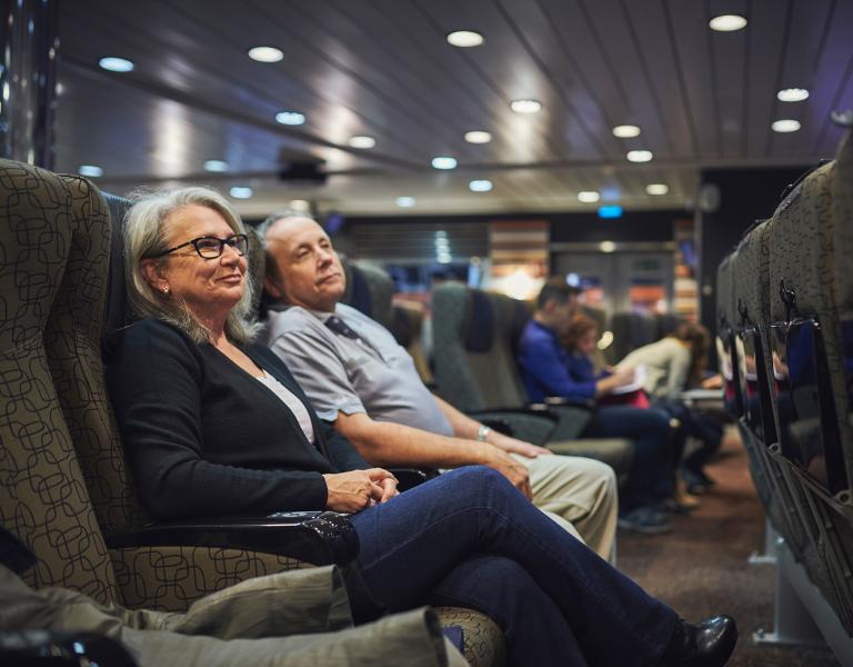 Elderly couple sitting about the ferry