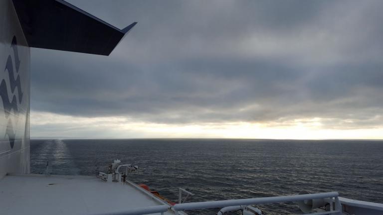 Image: View of the ocean from the port side of a ferry. 