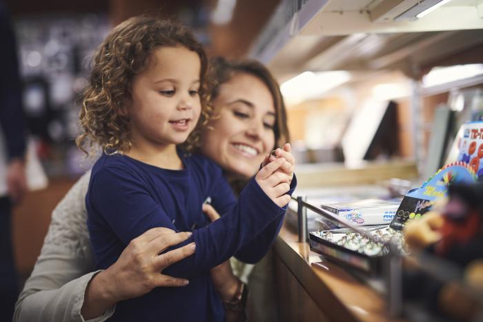 Little Girl Looking at Mom's Ring