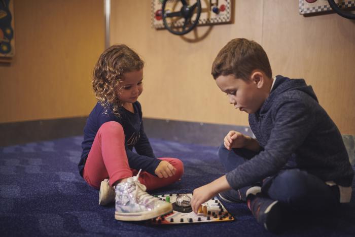 Girl and Boy Playing Board Games