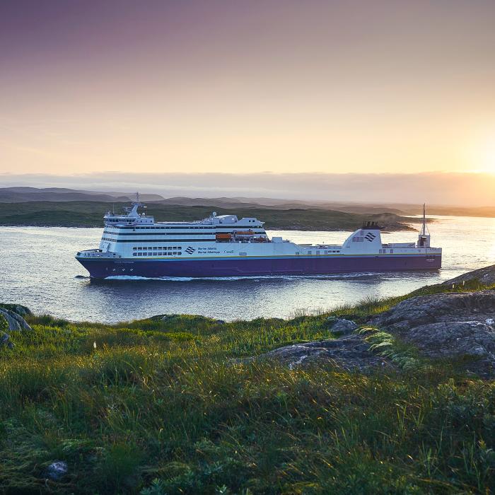 Blue Puttee ship sailing though water during sunrise