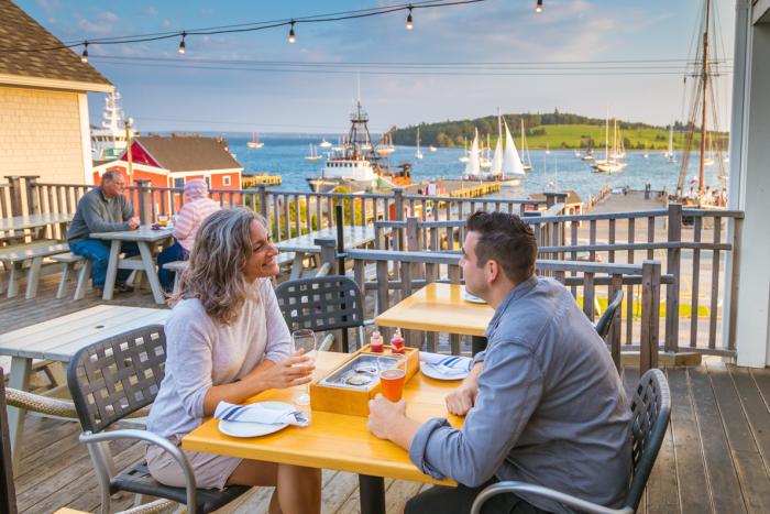 two people sit on patio on Lunenburg waterfront