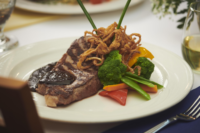 A steak dinner with vegetables