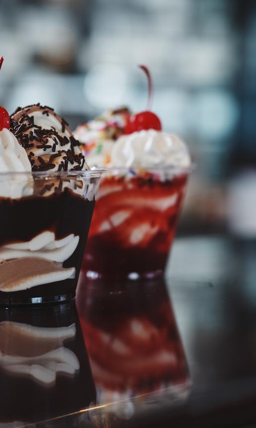 ice cream sundaes with cherries on top