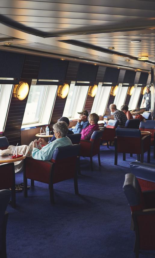 Passengers Looking Out Windows in Seating Area