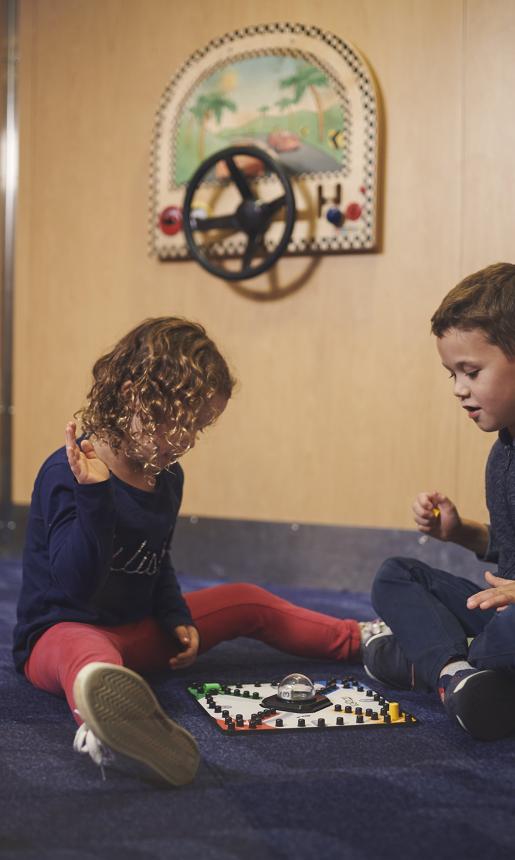 Little Boy and Girl Playing a Board Game