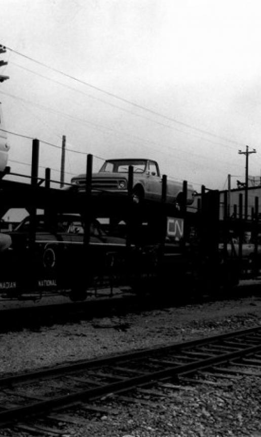 Image: view of cars loaded on rail cars