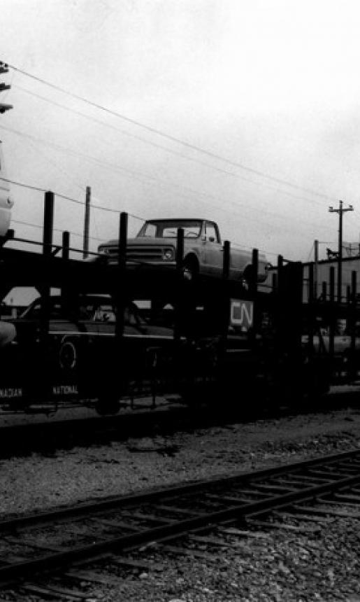 Image: view of cars loaded on rail cars 